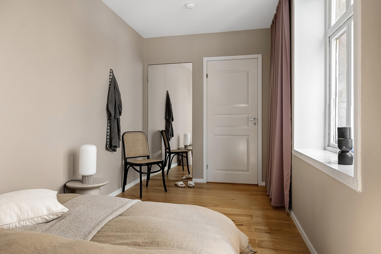 modern window shade installation in bedroom